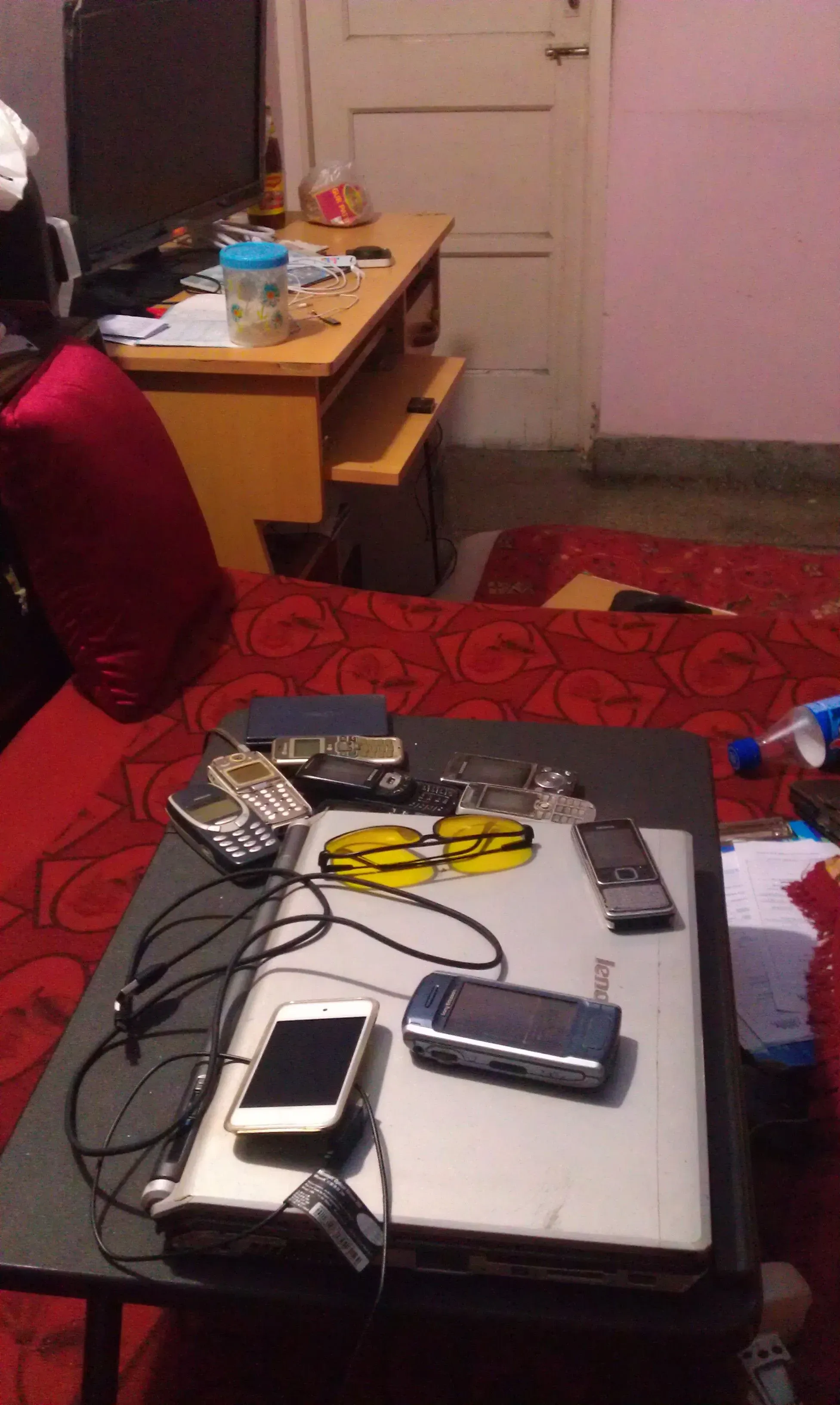 Bed with old phones, 2011